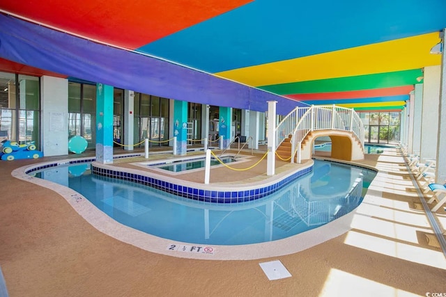 view of pool with a patio and a community hot tub