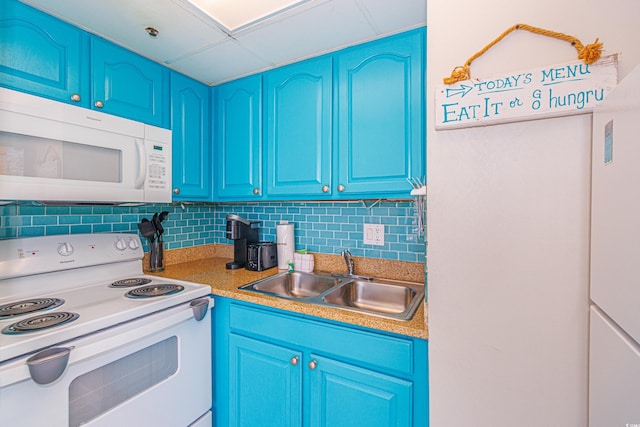 kitchen featuring sink, white appliances, a paneled ceiling, blue cabinetry, and tasteful backsplash