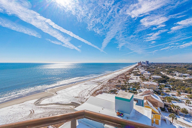 birds eye view of property with a water view and a view of the beach