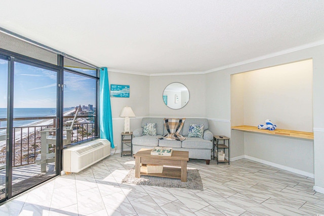 living room with a water view, ornamental molding, a wall mounted AC, and expansive windows