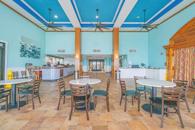 view of patio featuring a bar and ceiling fan