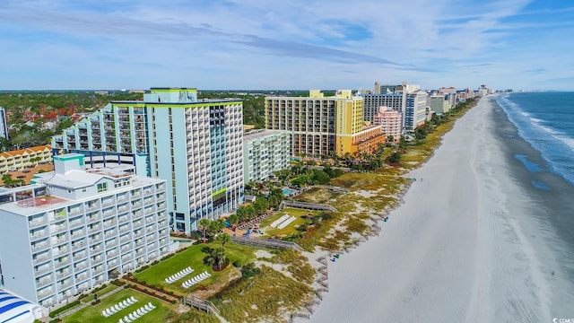 aerial view with a water view and a view of the beach