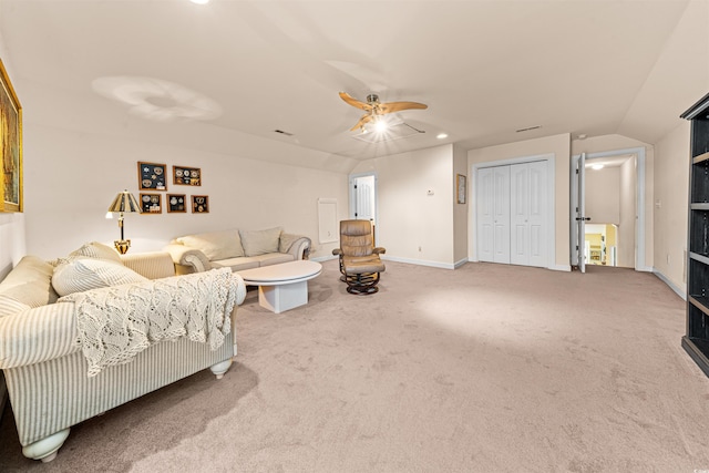 living room featuring vaulted ceiling, ceiling fan, and carpet floors