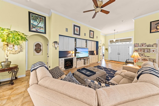 living room with wine cooler, ceiling fan, crown molding, and light tile patterned floors