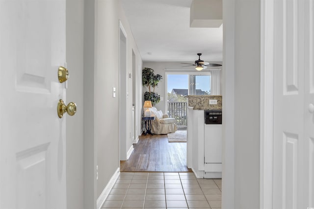 hall with light tile patterned flooring