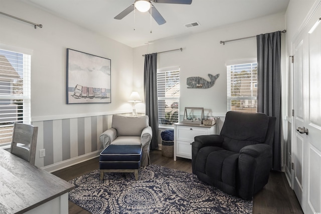 sitting room featuring dark hardwood / wood-style floors and ceiling fan