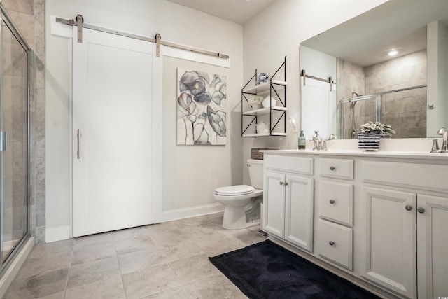 bathroom featuring a shower with door, vanity, and toilet