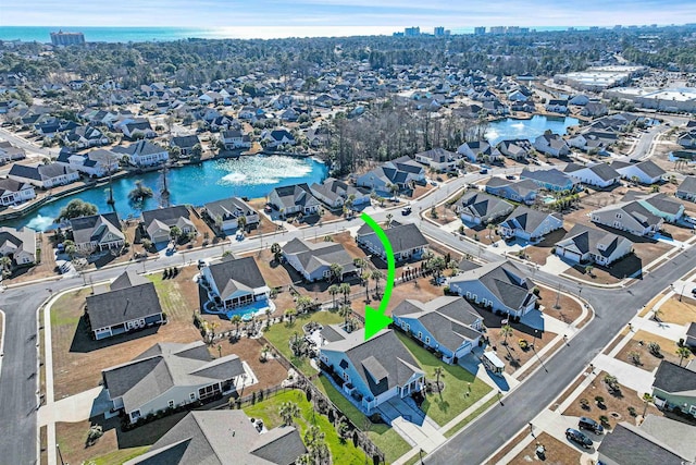 birds eye view of property with a water view