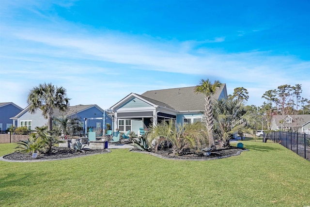 rear view of property with a patio and a yard