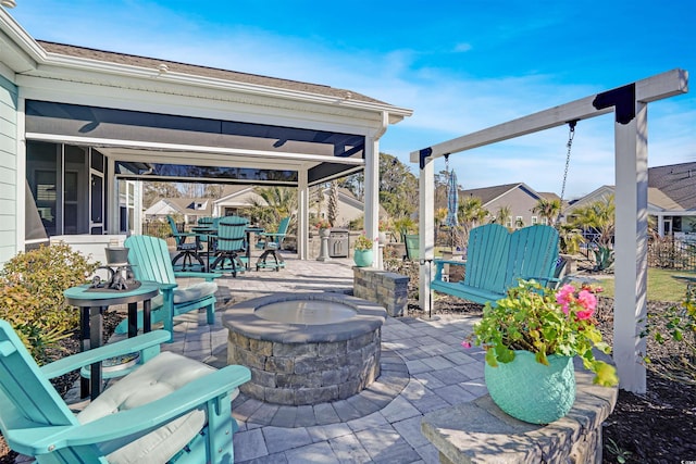 view of patio / terrace featuring an outdoor fire pit