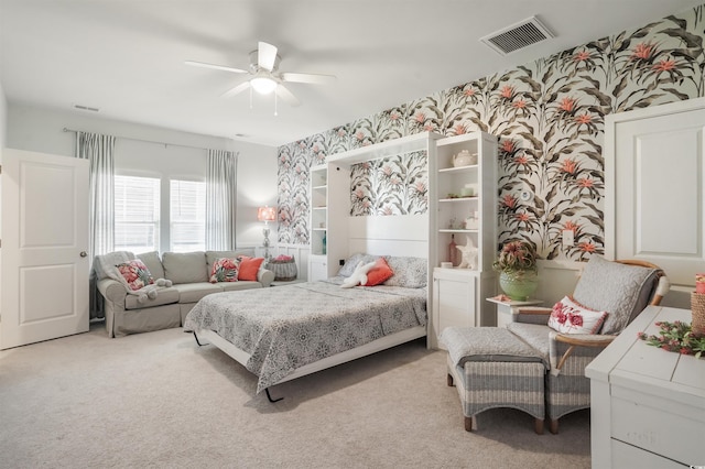 bedroom with ceiling fan and light colored carpet