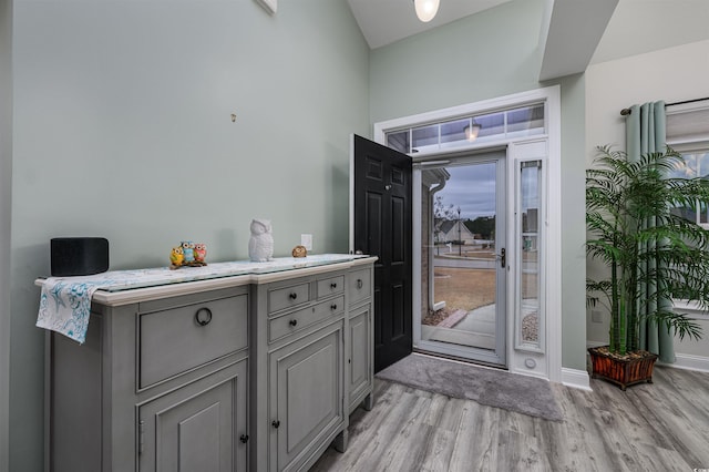 doorway to outside featuring light wood-type flooring