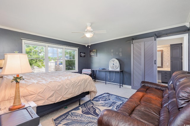 carpeted bedroom with crown molding, a barn door, ceiling fan, and ensuite bath