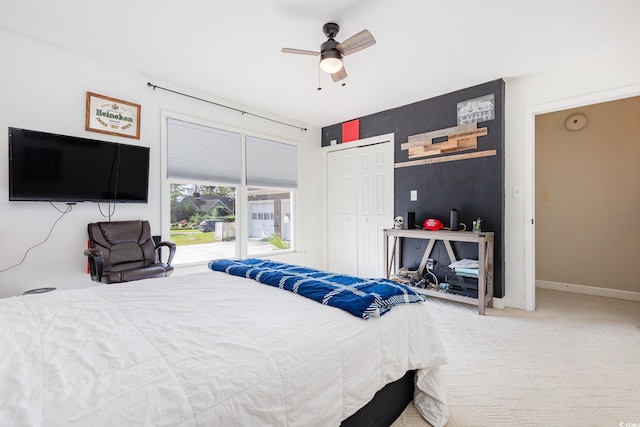 bedroom featuring carpet floors, ceiling fan, and a closet