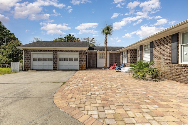 single story home with a garage