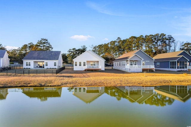 back of property with a water view