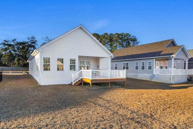 back of house with a deck