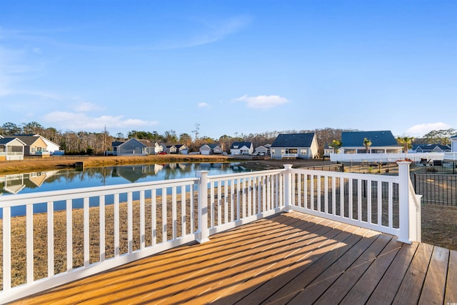 wooden deck with a water view