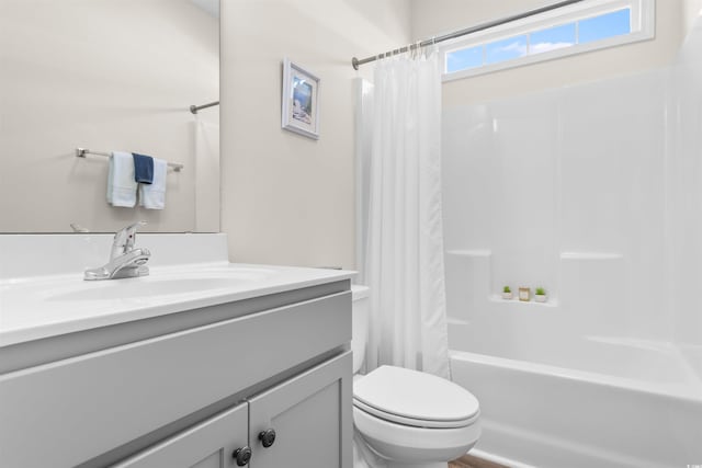 full bathroom featuring vanity, toilet, and shower / bath combo with shower curtain