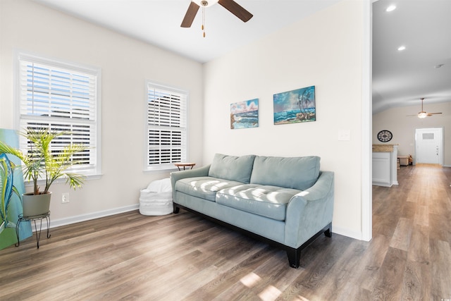 living room with hardwood / wood-style flooring and ceiling fan