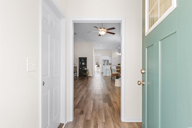 entrance foyer featuring wood-type flooring and ceiling fan