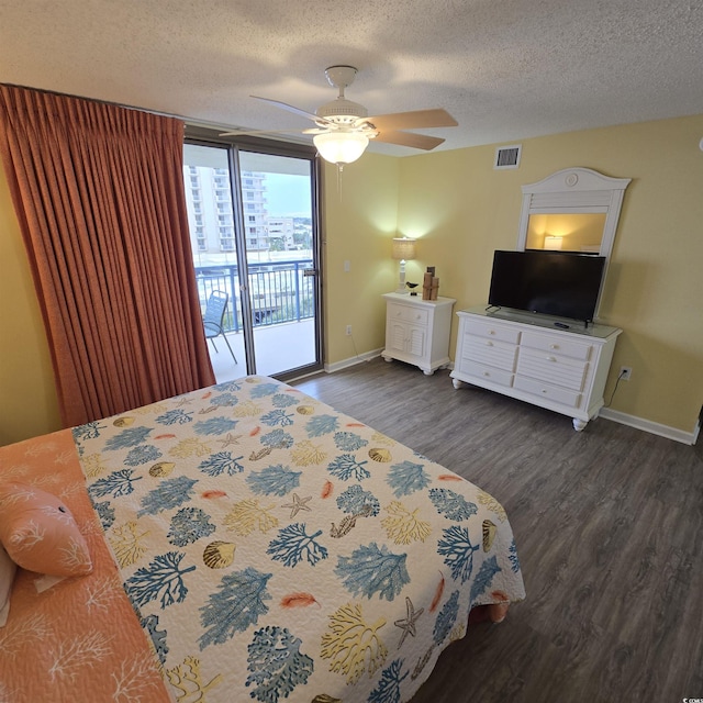 bedroom with ceiling fan, a textured ceiling, access to exterior, and dark hardwood / wood-style flooring