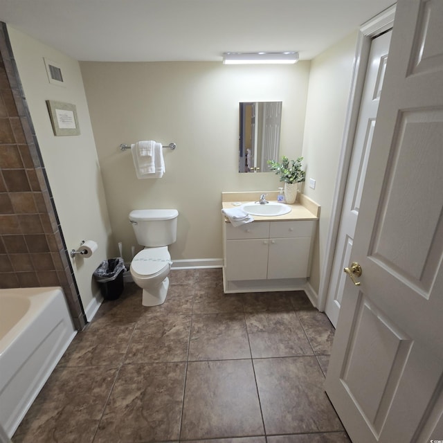 bathroom featuring vanity, tile patterned floors, and toilet