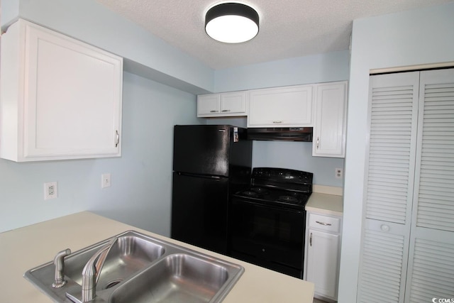 kitchen featuring white cabinetry, sink, a textured ceiling, and black appliances