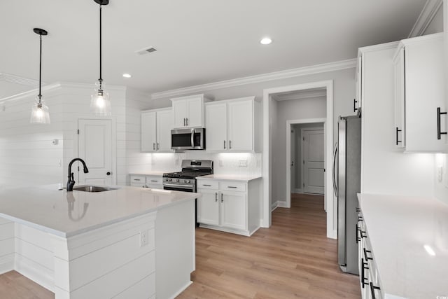 1201 Possum Trot Rd, North Myrtle Beach, SC 29582 - kitchen with appliances with stainless steel finishes, a sink, white cabinets, decorative backsplash, and recessed lighting