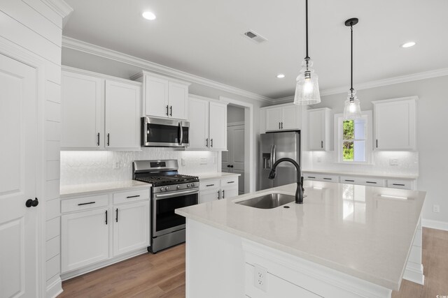 1201 Possum Trot Rd, North Myrtle Beach, SC 29582 - kitchen featuring appliances with stainless steel finishes, a sink, light wood finished floors, backsplash, and recessed lighting