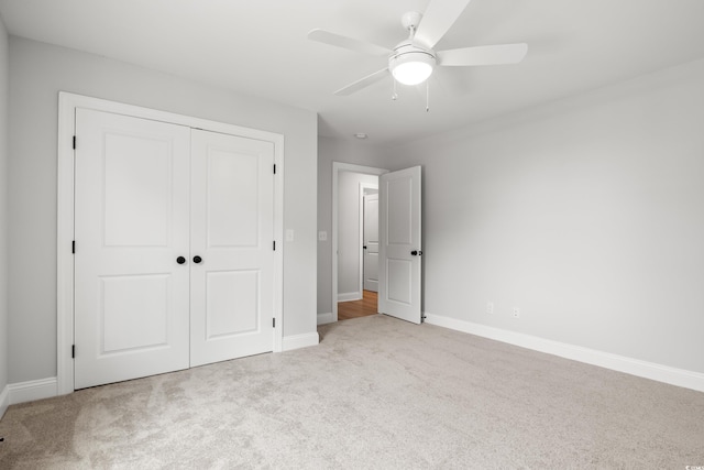 1201 Possum Trot Rd, North Myrtle Beach, SC 29582 - unfurnished bedroom with carpet flooring, a closet, baseboards, and ceiling fan