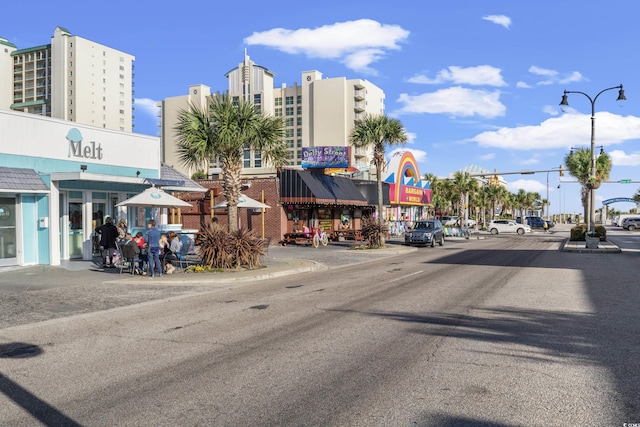 1201 Possum Trot Rd, North Myrtle Beach, SC 29582 - view of asphalt street featuring street lighting, sidewalks, and curbs
