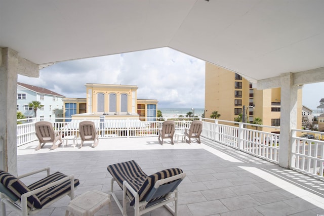 view of patio with a water view