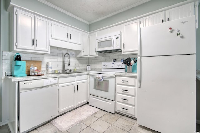 kitchen featuring sink, white appliances, a textured ceiling, and white cabinets