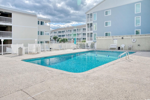 view of pool featuring a patio area