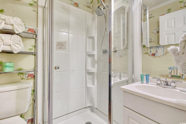 bathroom with walk in shower, ornamental molding, vanity, and toilet