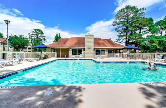 view of swimming pool featuring a patio area