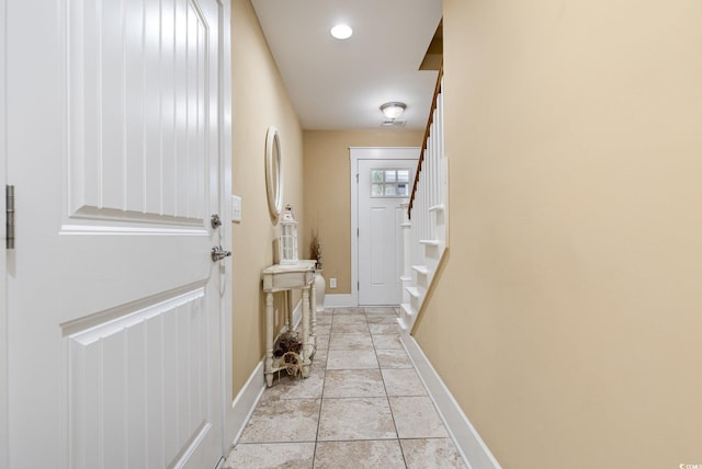 hallway with light tile patterned floors