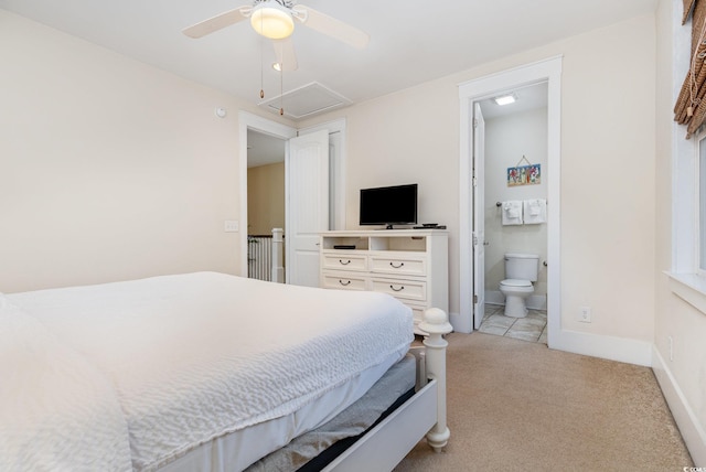 carpeted bedroom featuring connected bathroom and ceiling fan