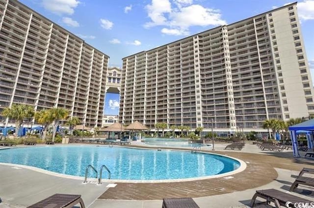 view of swimming pool featuring a patio area