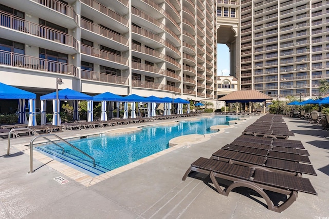 view of swimming pool with a gazebo and a patio