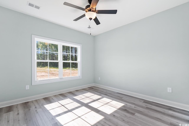 spare room with ceiling fan and light hardwood / wood-style flooring