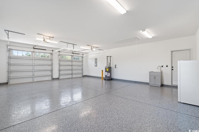 garage featuring white refrigerator, electric water heater, a garage door opener, and electric panel