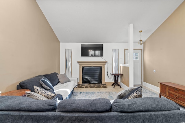 living room with lofted ceiling and light tile patterned floors