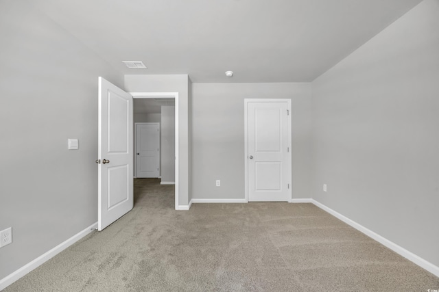 unfurnished bedroom featuring light colored carpet