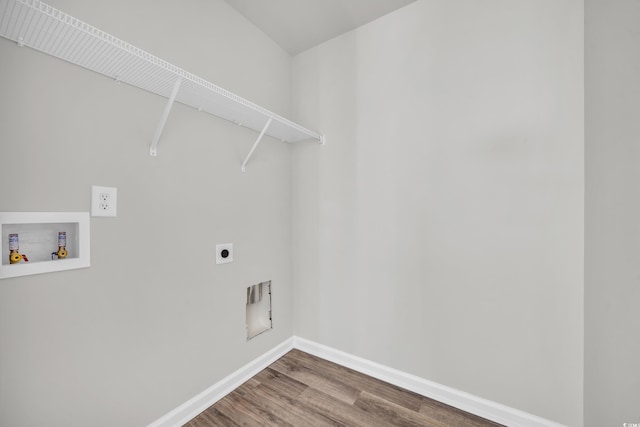 washroom featuring hardwood / wood-style flooring, hookup for an electric dryer, and hookup for a washing machine