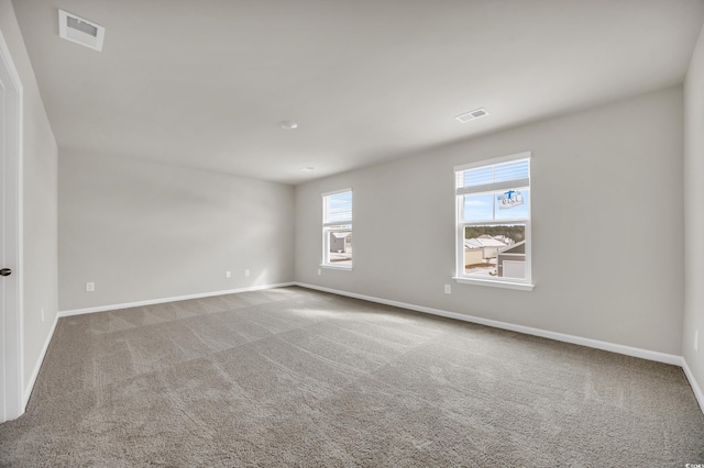 unfurnished room with carpet flooring