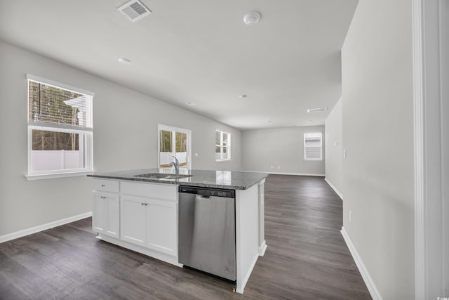 kitchen featuring a kitchen island with sink, white cabinets, dishwasher, and stone counters