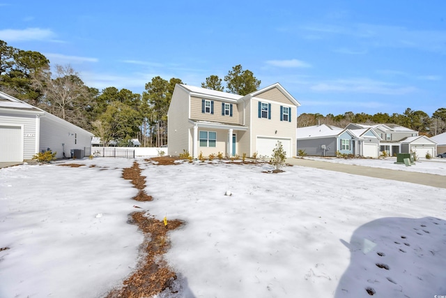 view of front of house with cooling unit and a garage