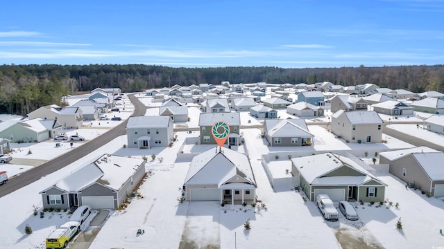 aerial view with a residential view and a wooded view